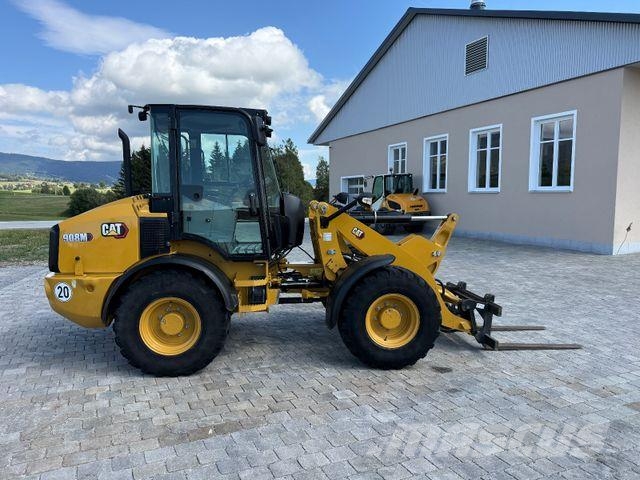 CAT 908M mit Schaufel und Gabel Cargadoras sobre ruedas