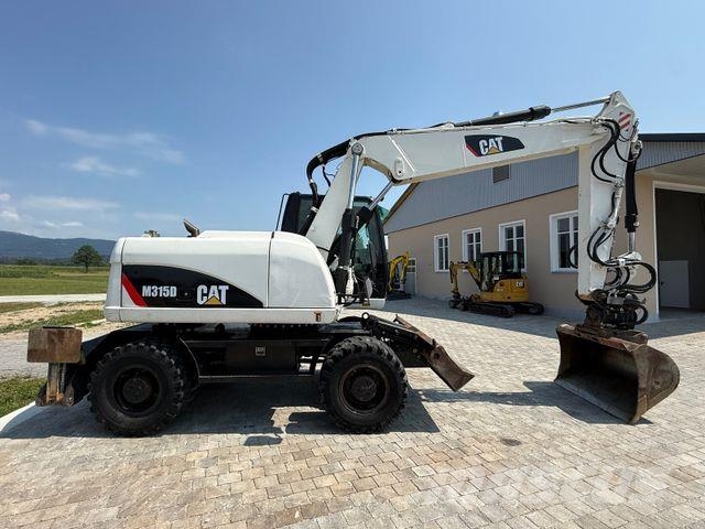 CAT M315D mit Powertilt حفارات بعجل