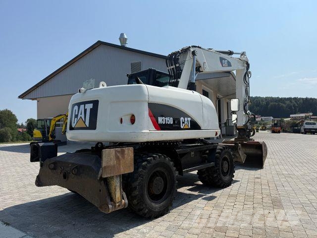 CAT M315D mit Powertilt حفارات بعجل