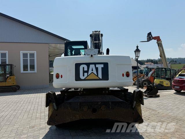 CAT M315D mit Powertilt حفارات بعجل