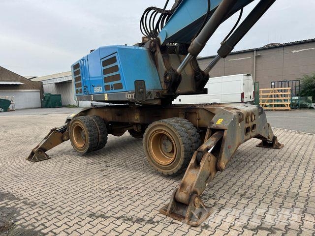 Fuchs MHL 360 F Umschlagbagger mit Greifer Wielgraafmachines
