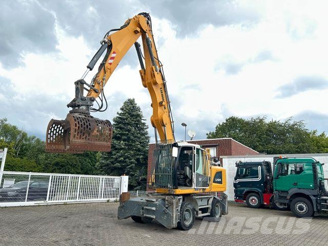 Liebherr LH 24 Litronic mit Abbruch- / Sortiergreifer حفارات بعجل