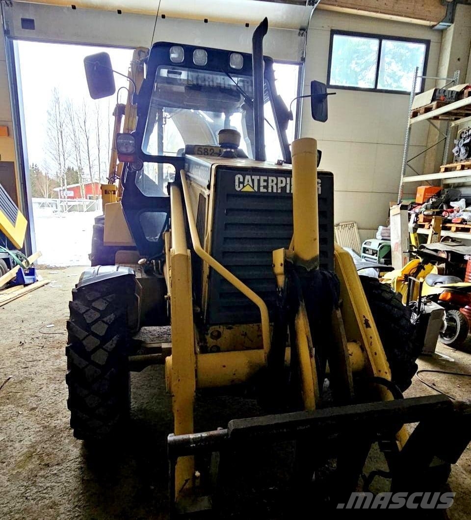 CAT 438B, trukkipiikit, 6 kauhaa Rovokopači