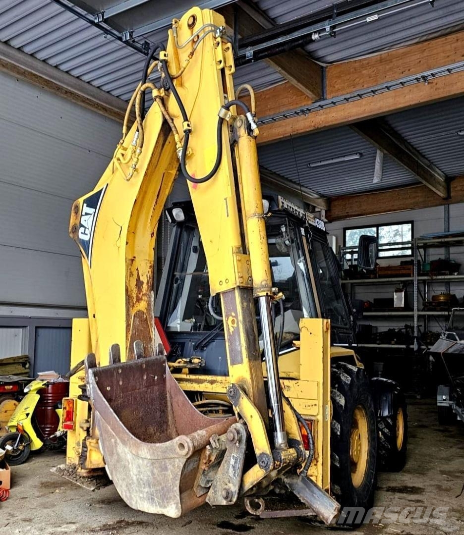 CAT 438B, trukkipiikit, 6 kauhaa Rovokopači