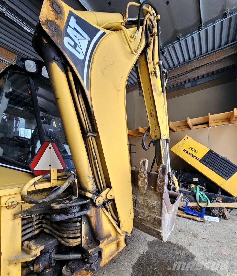 CAT 438B, trukkipiikit, 6 kauhaa Rovokopači