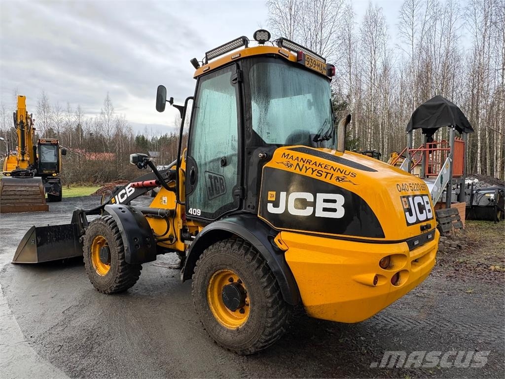 JCB 409 *VAIN 2864h* Nivelaura, kaksi kauhaa saatavill Hjullastare