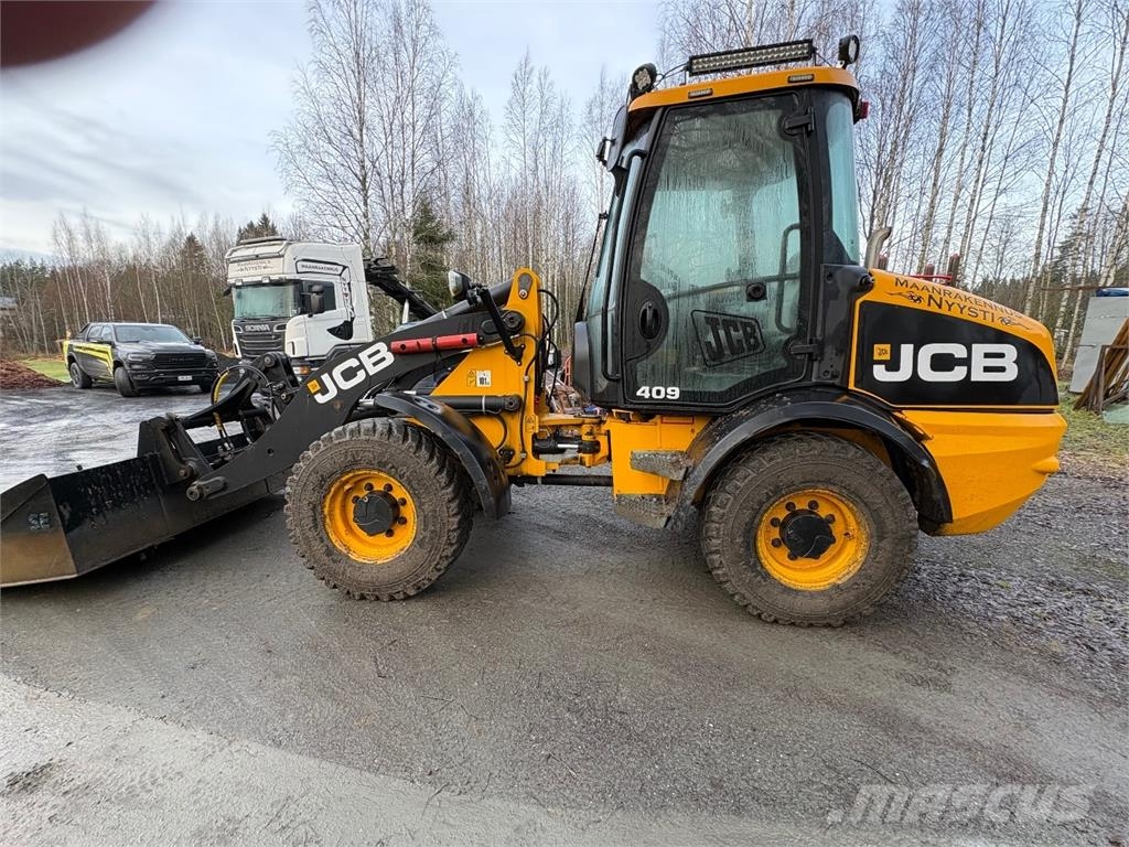JCB 409 *VAIN 2864h* Nivelaura, kaksi kauhaa saatavill Hjullastare