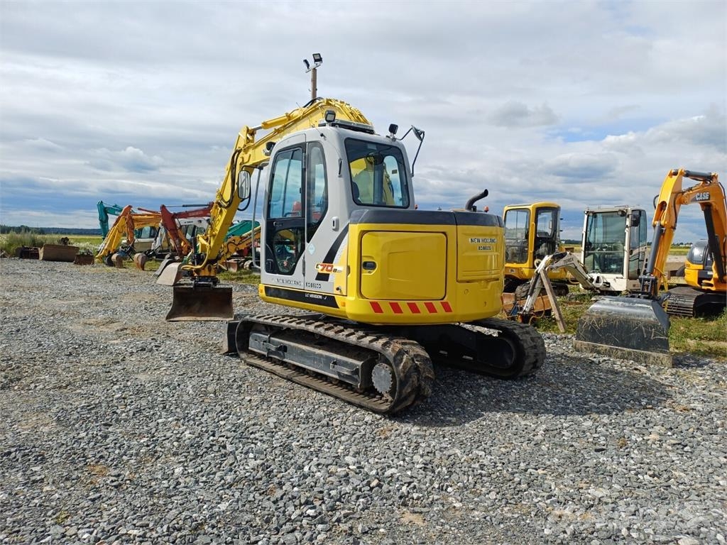 New Holland E70BSR-2 pihti engconilla Midigraafmachines 7t - 12t