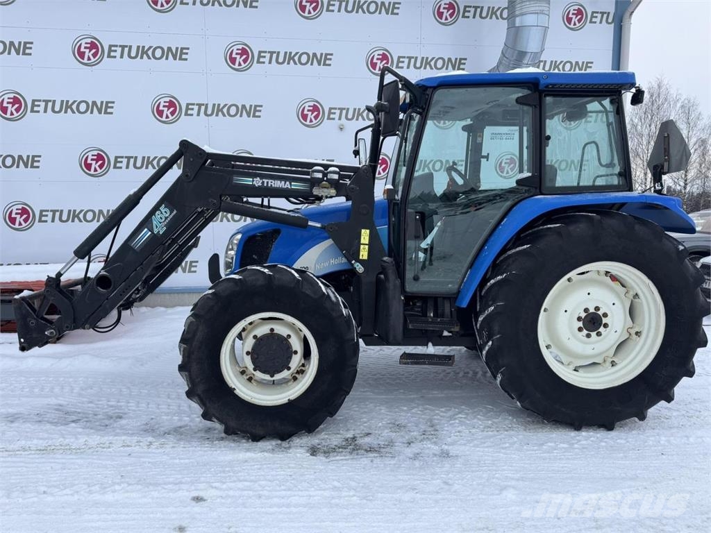 New Holland TL100A DC + Etukuorm. Traktoriai