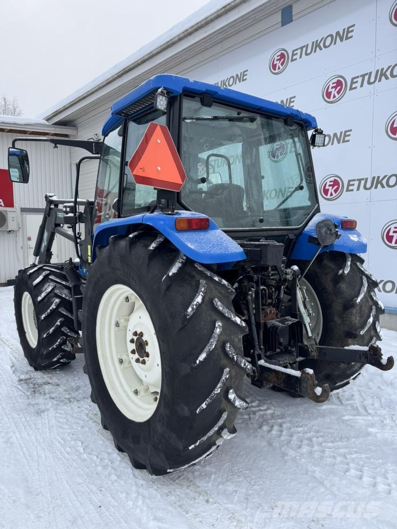 New Holland TL100A DC + Etukuorm. Traktoriai