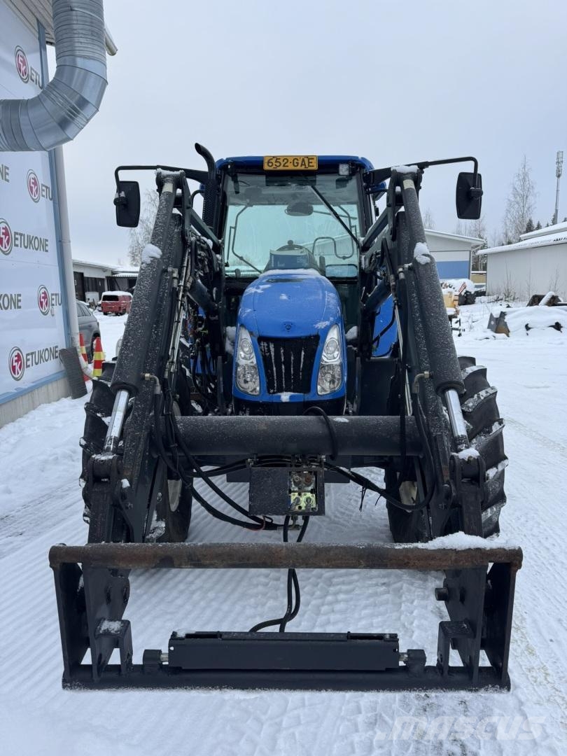 New Holland TL100A DC + Etukuorm. Traktoriai
