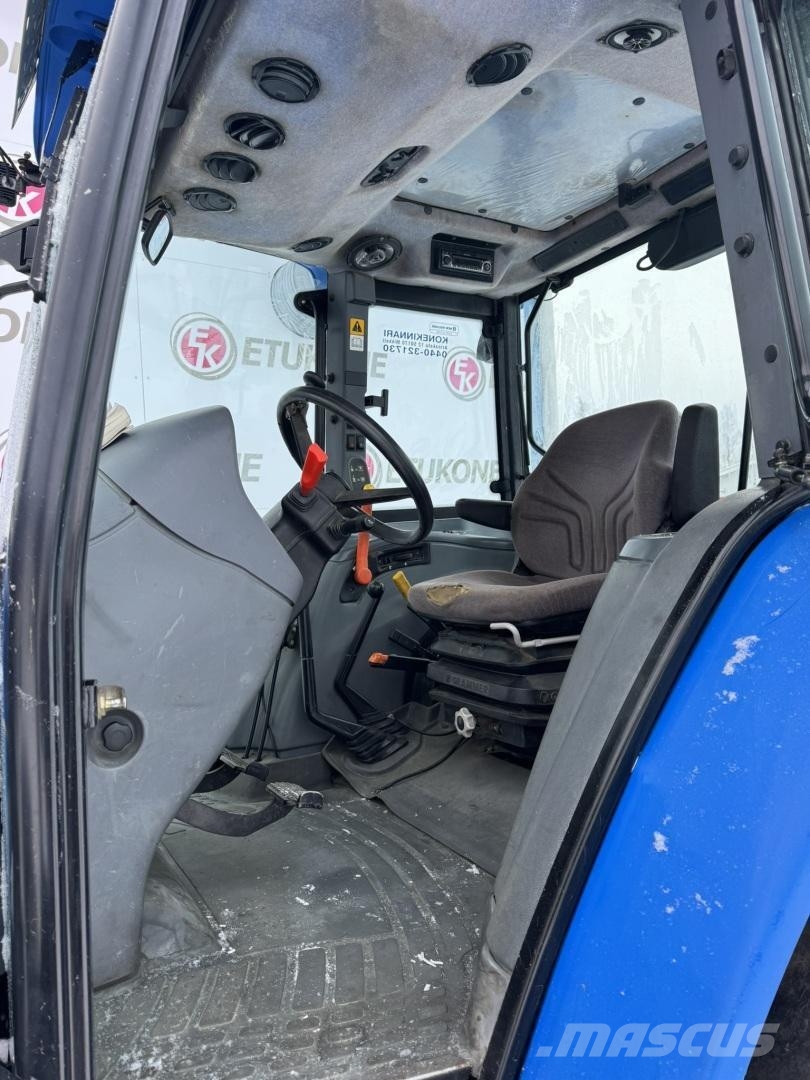New Holland TL100A DC + Etukuorm. Traktoriai