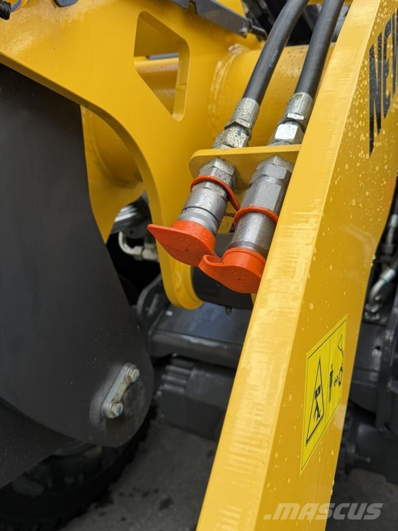 New Holland W100D Pyöräkuormaaja Фронтальні навантажувачі