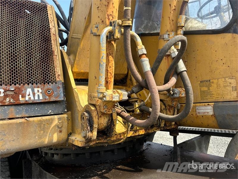 CAT M318C Ekskavatori uz riteņiem