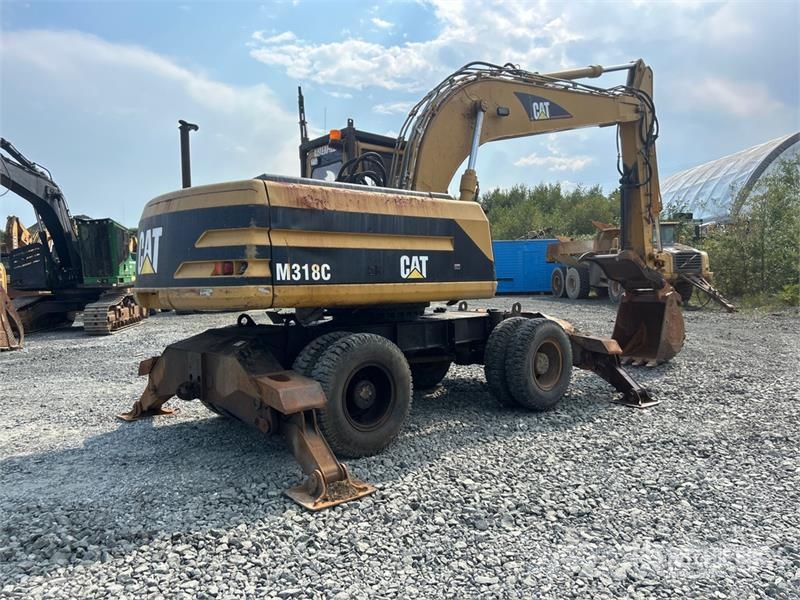 CAT M318C Ekskavatori uz riteņiem