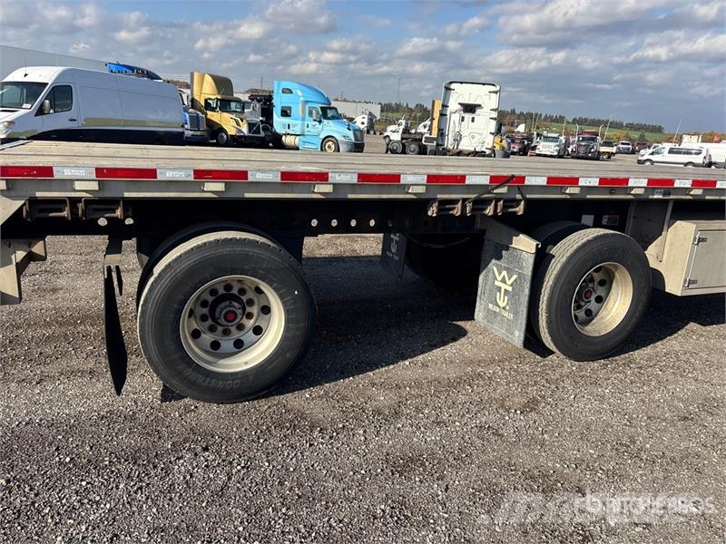 Wilson Roadbrute 53 ft T/A Spread Axle Flatbed Trailer Rimorchi con sponde ribaltabili