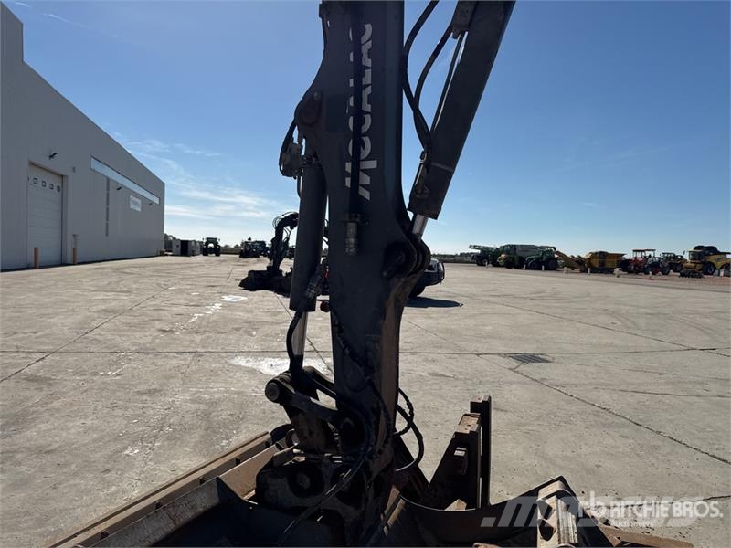 Mecalac 12MTX حفارات بعجل