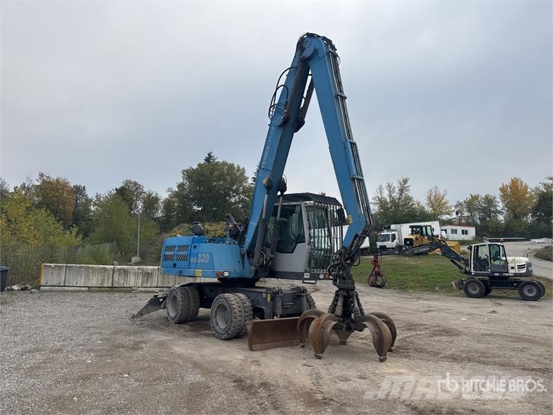 Terex Fuchs MHL320 Pelle De Manutention Wheel Material Handler معدات البناء - غير ذلك