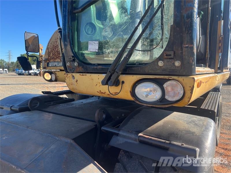 CAT M318D Gravemaskiner på hjul