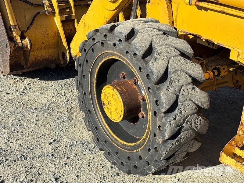 CAT 446D Rovokopači