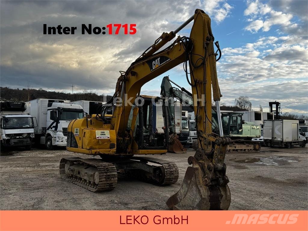 CAT 311C Mit Zwei Löffeln Rupsgraafmachines