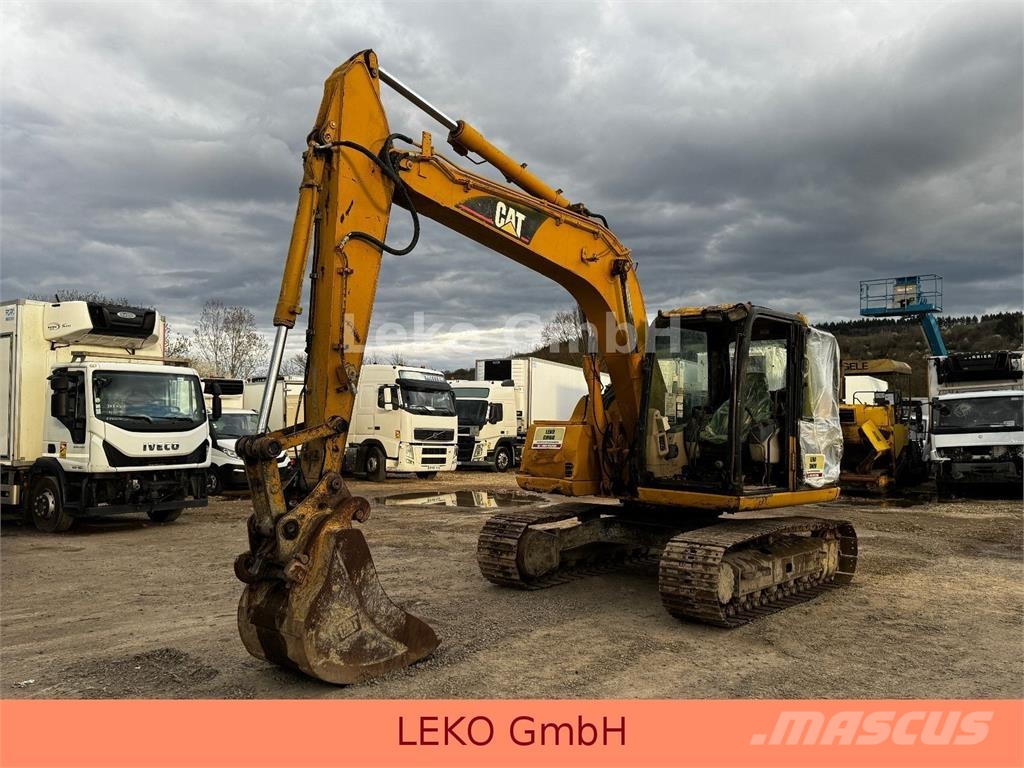 CAT 311C Mit Zwei Löffeln Rupsgraafmachines