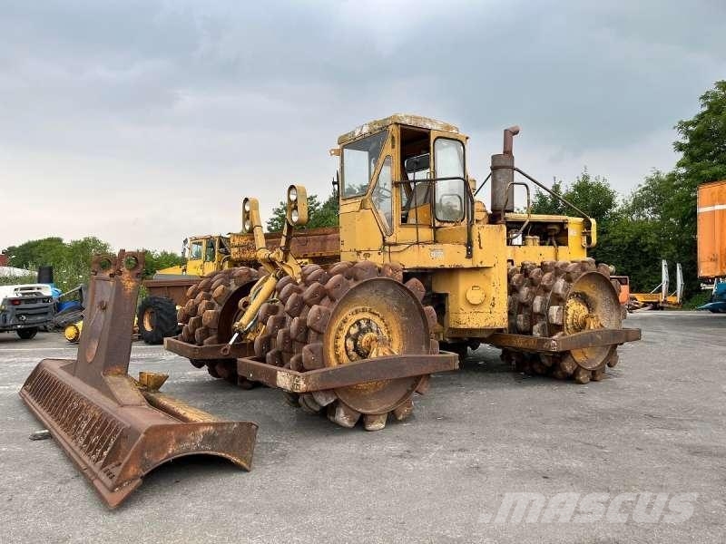 CAT 825 + porte engins Kompaktori zemlje