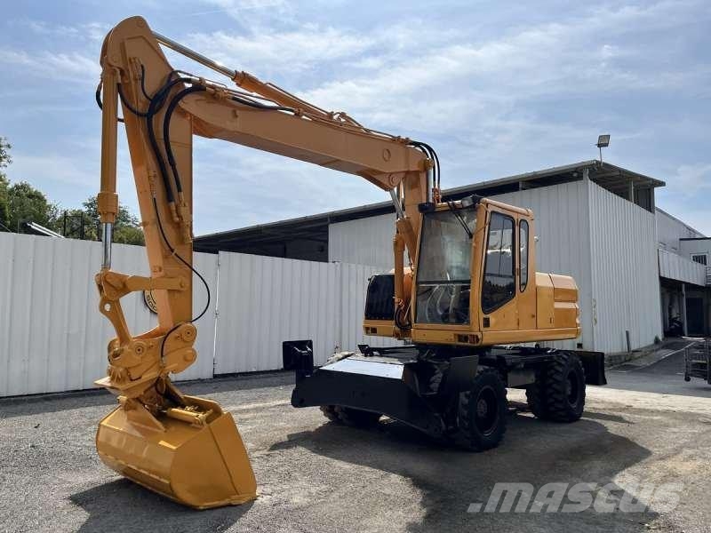 CAT M315 Bagri na kolesih