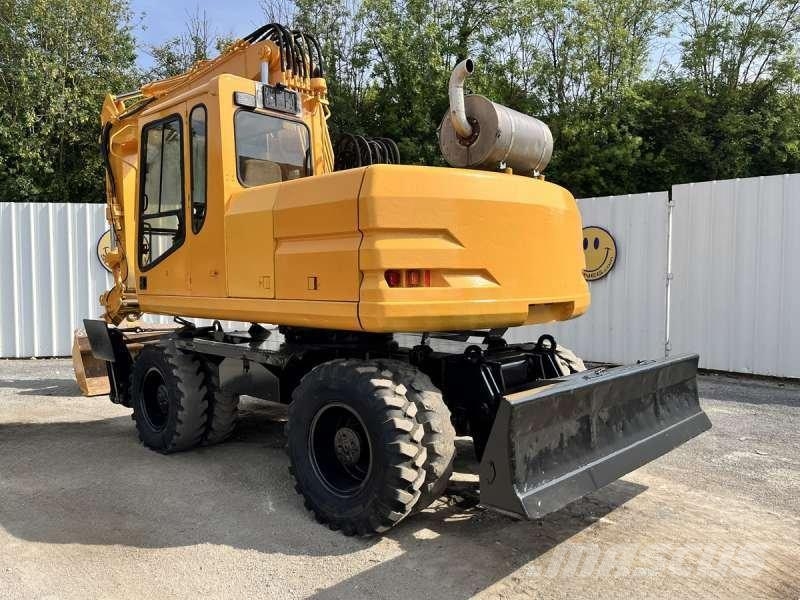 CAT M315 Bagri na kolesih