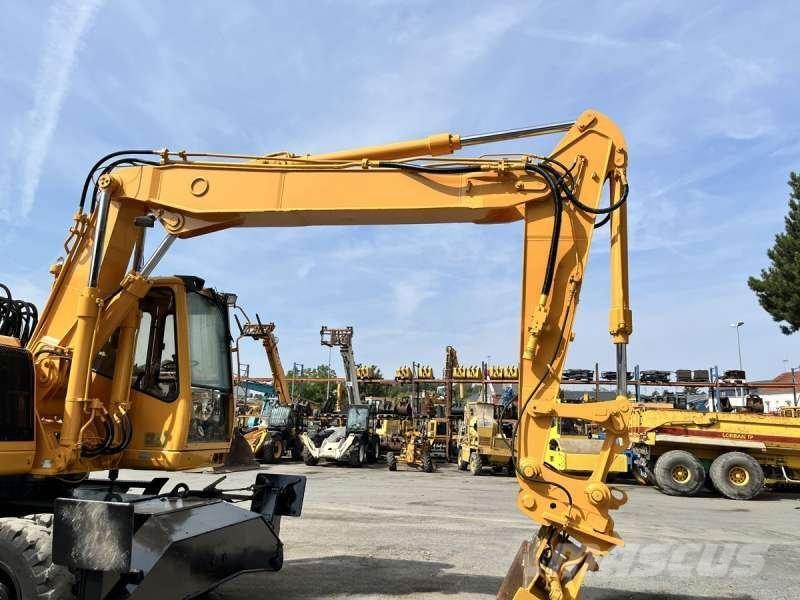 CAT M315 Bagri na kolesih