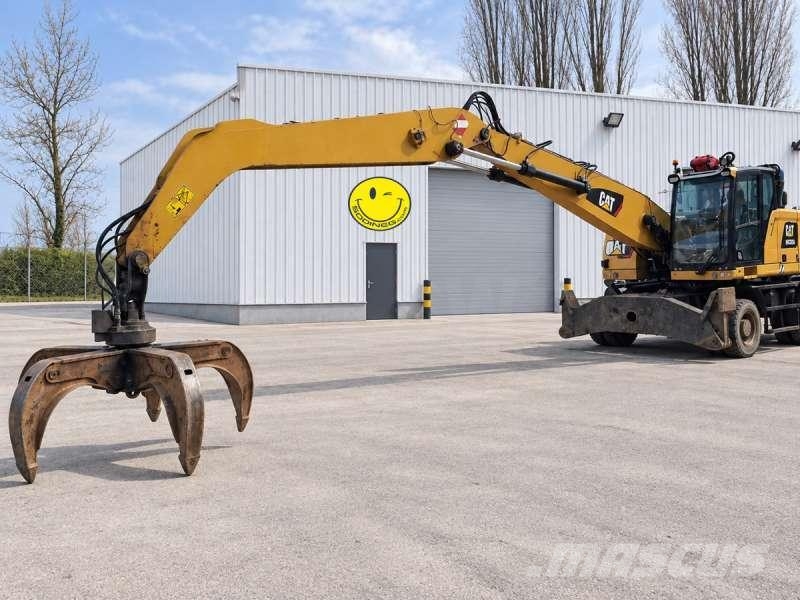 CAT MH3024 + grappin Materialumschlag