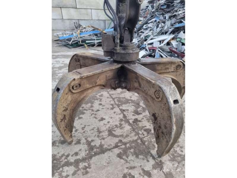 CAT MH3024 + grappin Materialumschlag