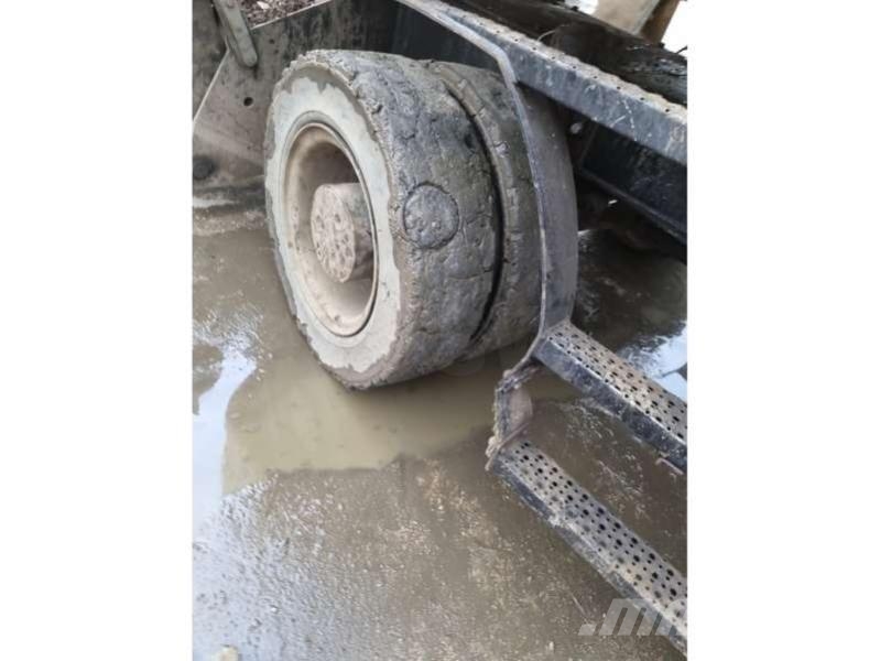 CAT MH3024 + grappin Materialumschlag